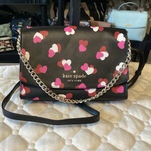 Kate spade black leather crossbody with a silver chain handle and long strap